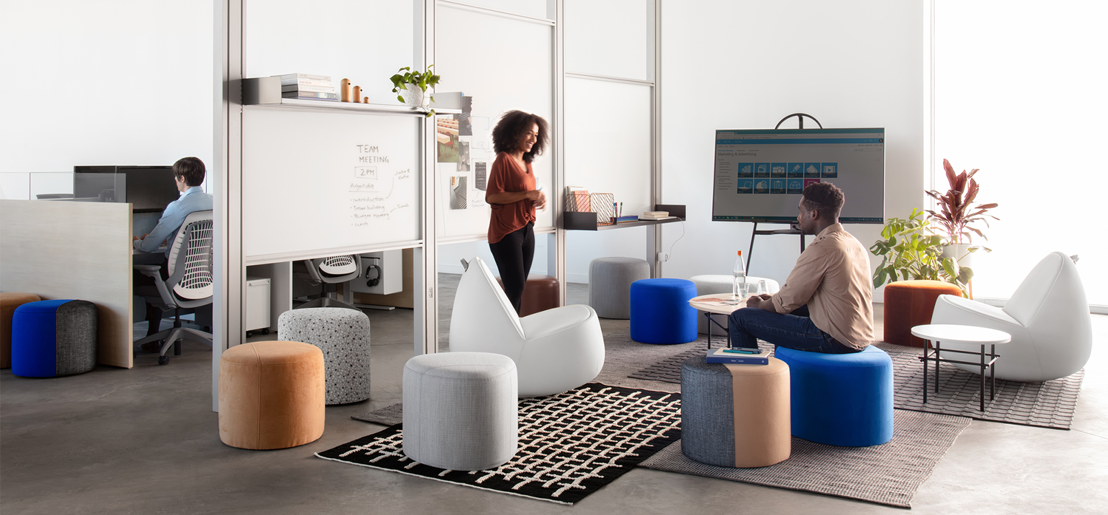 View of team meeting in lounge with stylish seating