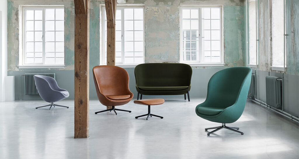 Minimal industrial lounge with accent egg-style chairs
