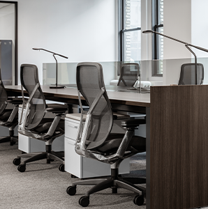 Angled view of long desk with office seating